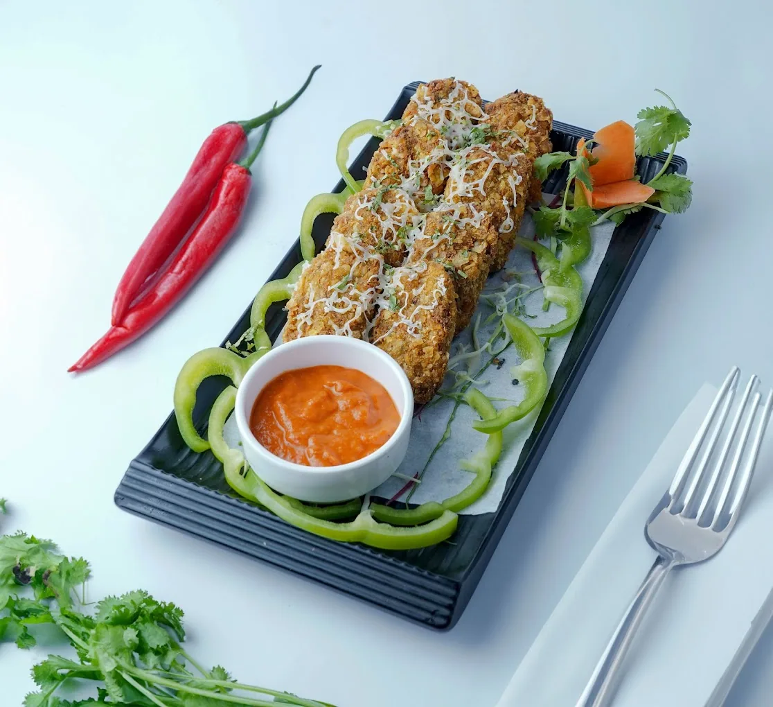 Rava-crusted fried fish on slate