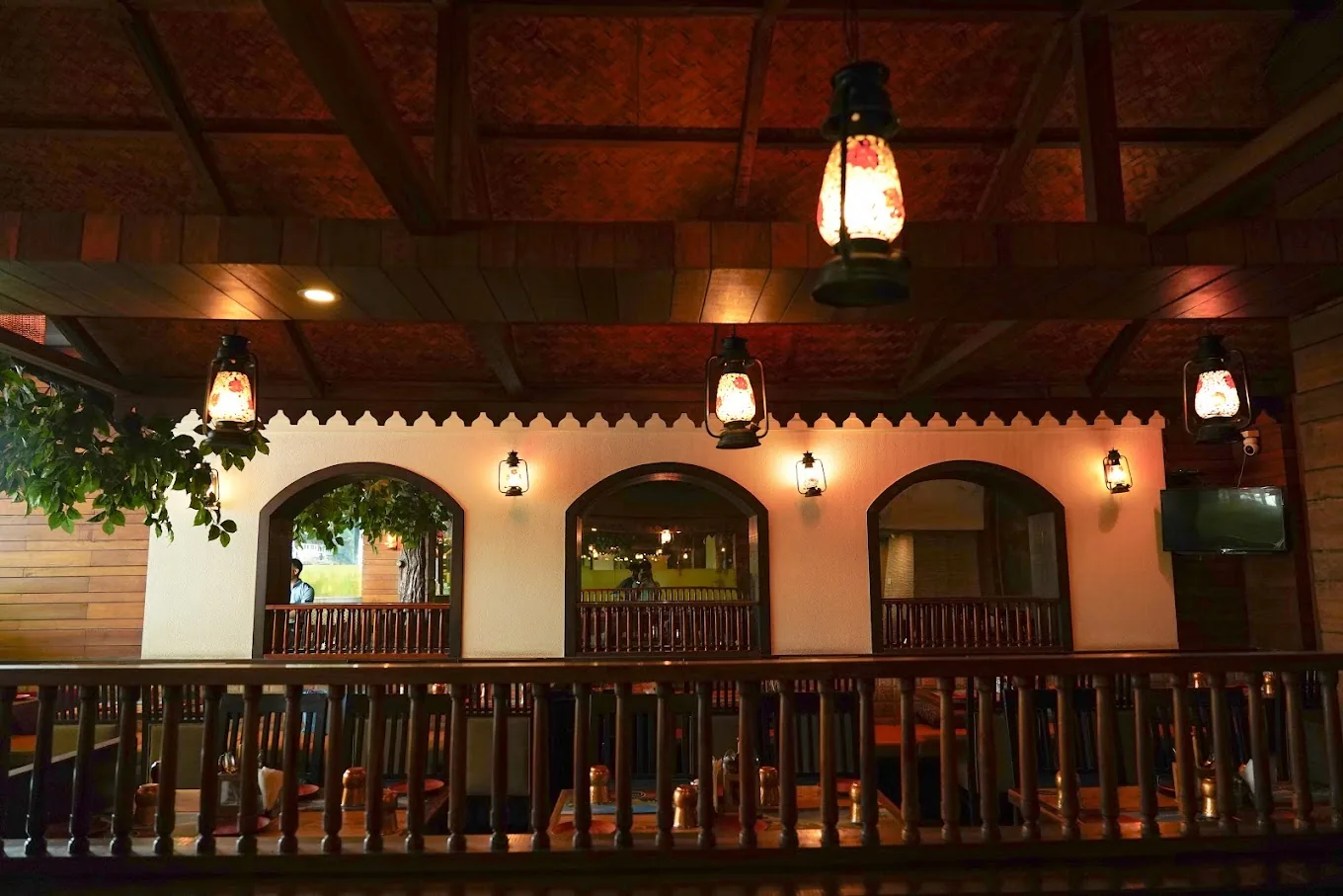 Arched windows, lanterns and a wood ceiling