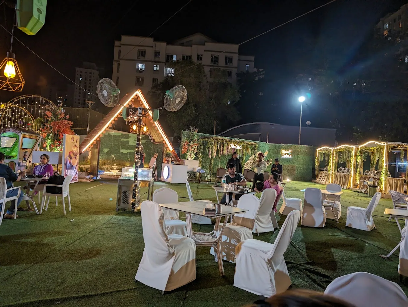 The party lawn under string lights